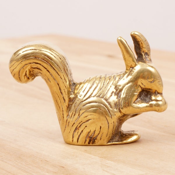 Squirrel holding nut in her hands || vintage heavy solid brass
