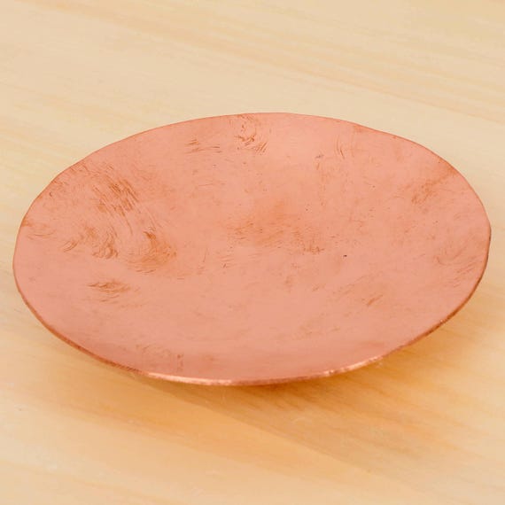 Hand-hammered copper dish with a raw, antique beaten texture that looks like it was rescued from a Victorian apothecary.