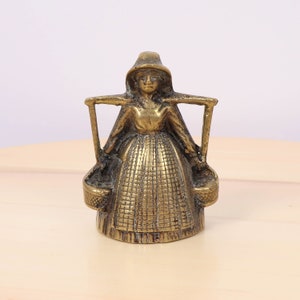 Lady farmer holding two buckets on her shoulders / water lady bell / hand bell in a shape of a lady ||  Vintage solid brass