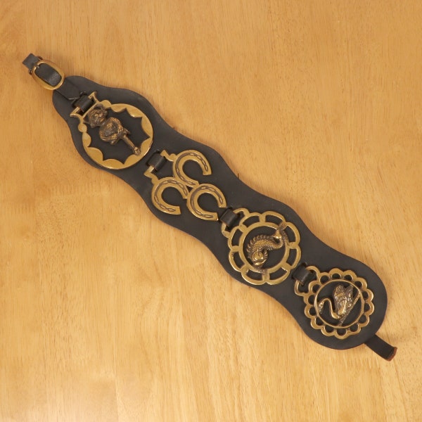 4 Horse Brass Badges on black leather belt || Vintage solid brass || Dragon / swan / pixie / horseshoe