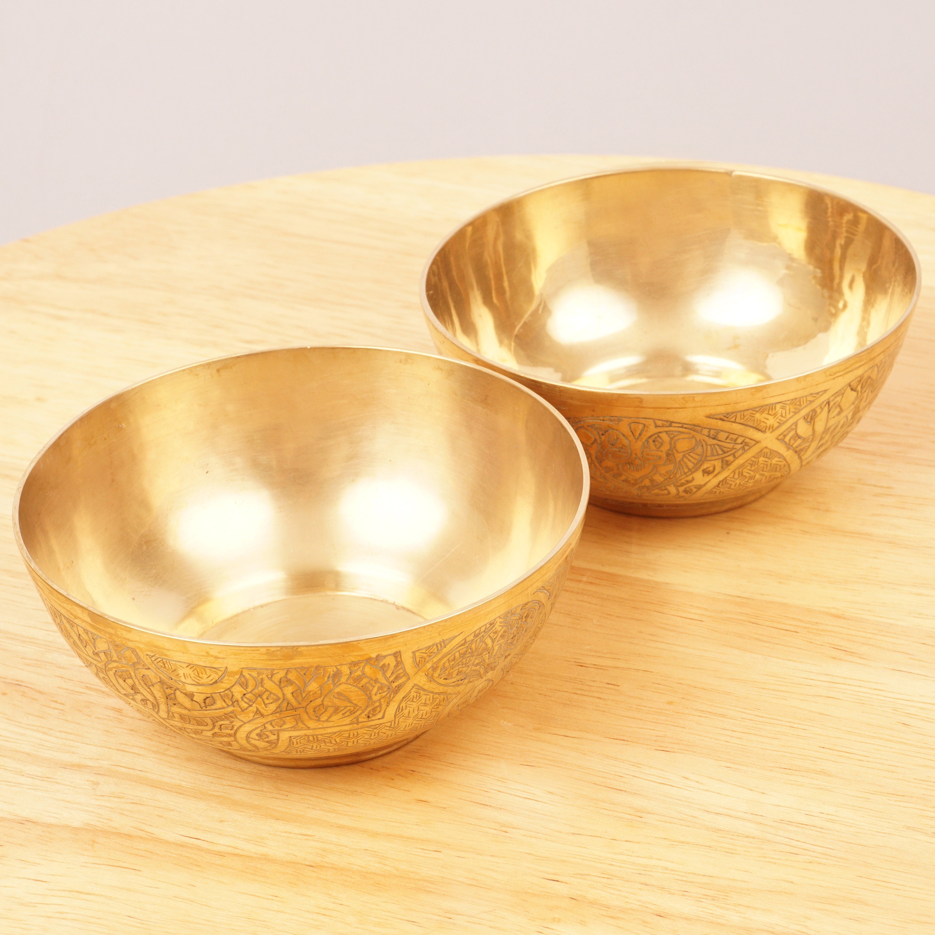 Set of two solid brass bowls with engraved pattern and Arabic characters