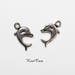 10 x silver plated Dolphin charms