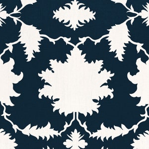 May include: A repeating pattern featuring white floral and leaf silhouettes against a dark navy blue background. The design has a symmetrical arrangement of stylized botanical elements, creating a classic, elegant aesthetic.