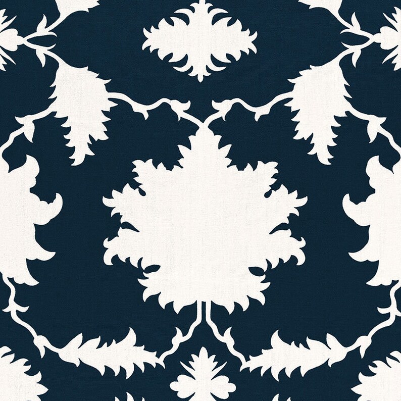 May include: A repeating pattern featuring white floral and leaf silhouettes against a dark navy blue background. The design has a symmetrical arrangement of stylized botanical elements, creating a classic, elegant aesthetic.