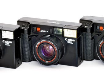 FoR PaRTS Canon ML AF35 ML 35mm Cameras 3X  w 40mm f/1.9 Lens Non-Working