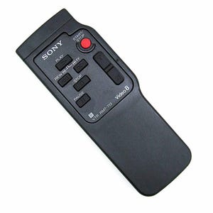 May include: A black Sony Video 8 remote control with buttons for play, rewind, stop, and pause. The remote has a red start/stop button and the text "Video 8" is visible.