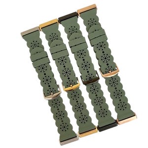 May include: Four olive green watch bands with floral cutouts and various metal clasps. The bands are made of a flexible material and feature a repeating flower pattern. The clasps are in gold, silver, and black tones.