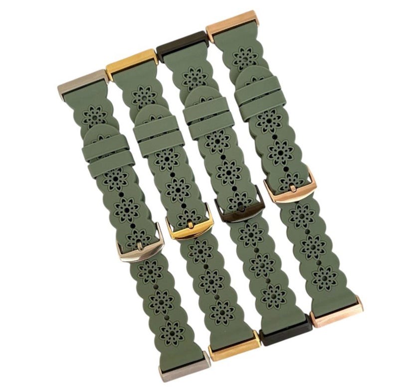 May include: Four olive green watch bands with floral cutouts and various metal clasps. The bands are made of a flexible material and feature a repeating flower pattern. The clasps are in gold, silver, and black tones.