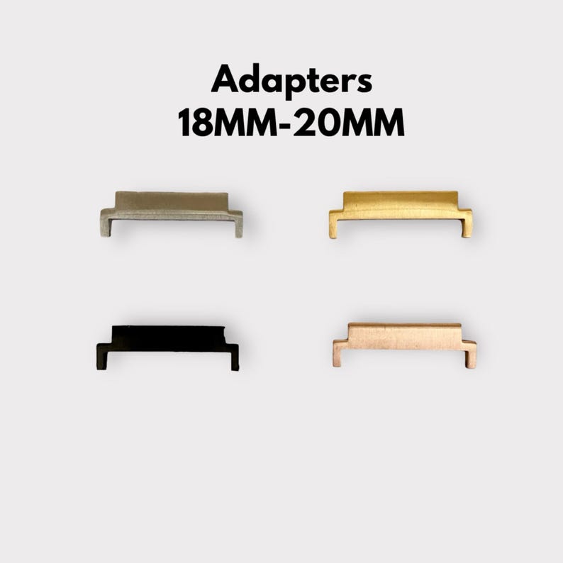 May include: Four watch strap adapters in different finishes: silver, gold, black, and rose gold. The adapters are designed to convert an 18mm watch strap to a 20mm watch strap. Adapters 18MM-20MM