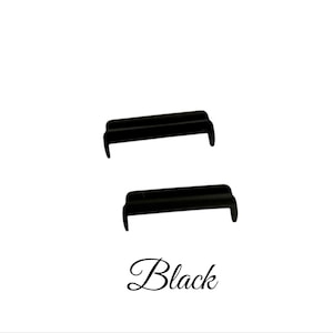 May include: Two black plastic guitar bridge saddles.