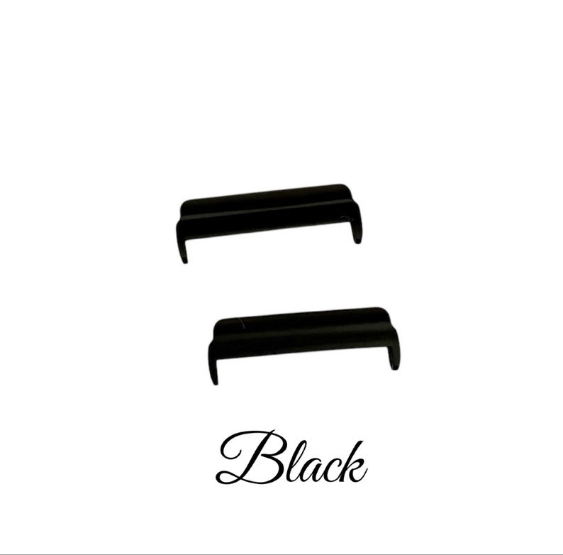 May include: Two black plastic guitar bridge saddles.