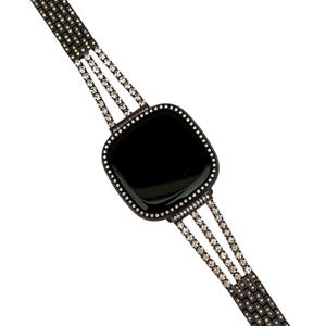 May include: A black smartwatch with a black band adorned with rows of clear rhinestones. The watch face is square and has a black background.