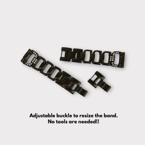 May include: Black watch band with a crystal-embellished buckle. The band is made of metal links and has an adjustable buckle.  "Adjustable buckle to resize the band. No tools are needed!"