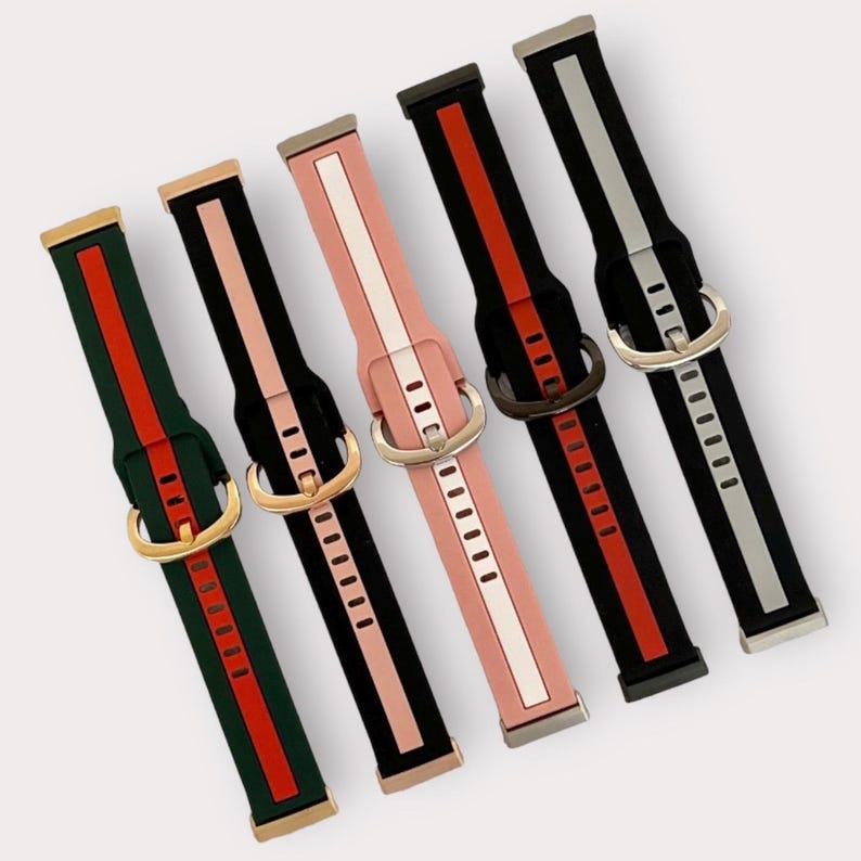 May include: Set of six watch bands with different color combinations. Each band has a contrasting stripe and a buckle closure.