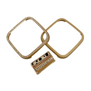 May include: Gold-toned watch band with a decorative, sparkly, square frame and a black and white patterned band with rhinestones.