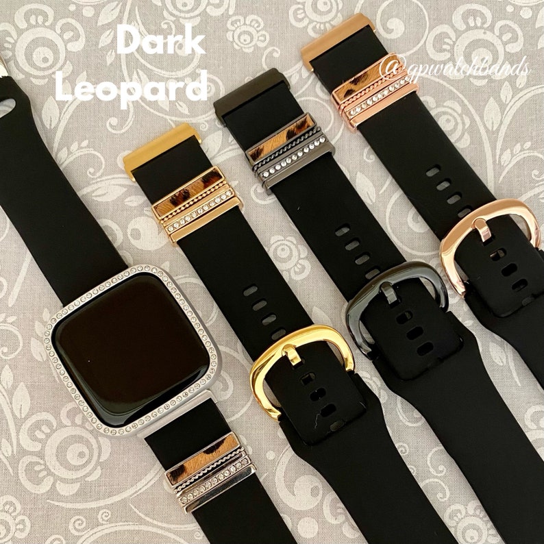 May include: Four black watch bands with different colored buckles and a leopard print design. The bands have rhinestones on the buckle and the print.  The text "Dark Leopard" is visible in the image.