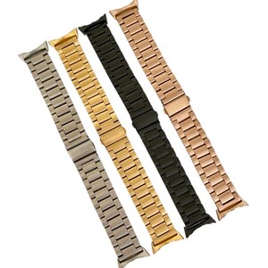 May include: Four metal watch bands in silver, gold, black, and rose gold. The bands are all the same style, with a classic link design.