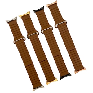 May include: Four brown silicone watch bands with different colored metal clasps. The bands have a ribbed texture and are designed for Apple Watch.