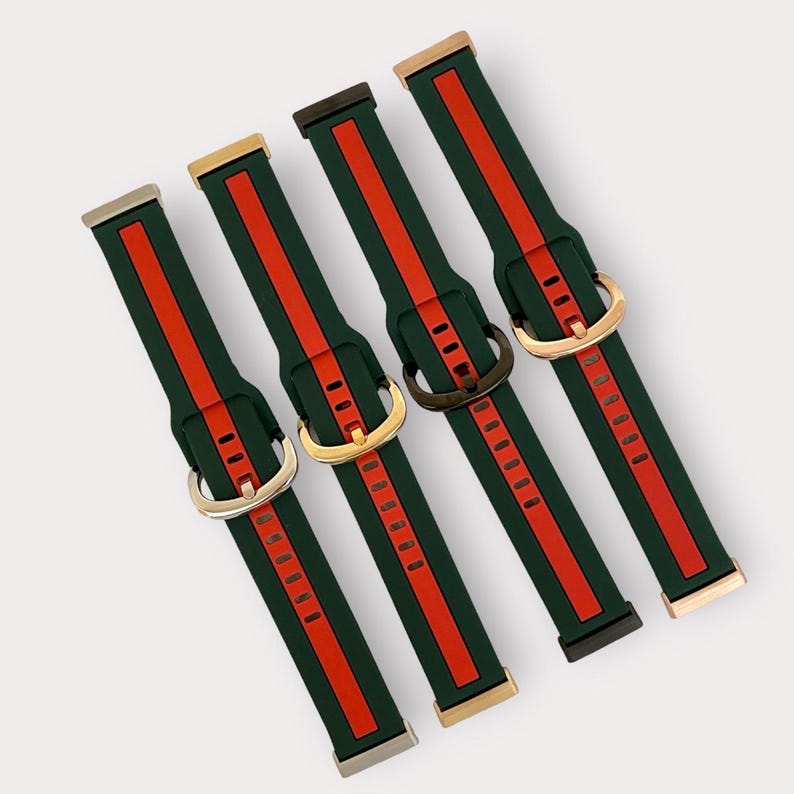 May include: Four different colored watch bands with a green and red striped pattern. The bands have gold, silver, and black buckles.