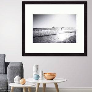 Fine art black and white photographic print of boy running in the surf, in Long Beach, CA. Print or Framed Print Available