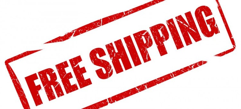 May include: A red rectangular stamp with the words "FREE SHIPPING" in bold, distressed font. The stamp is slightly angled, with a white background. The text is in a bold, sans-serif font.