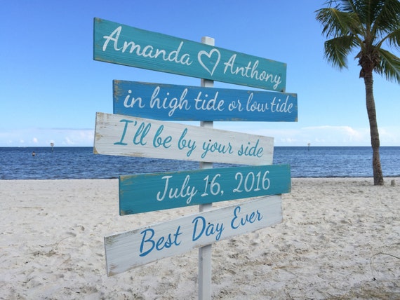 Wedding direction sign. In high tide or low tide wood sign