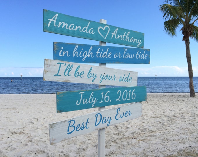 Wedding direction sign. In high tide or low tide wood sign