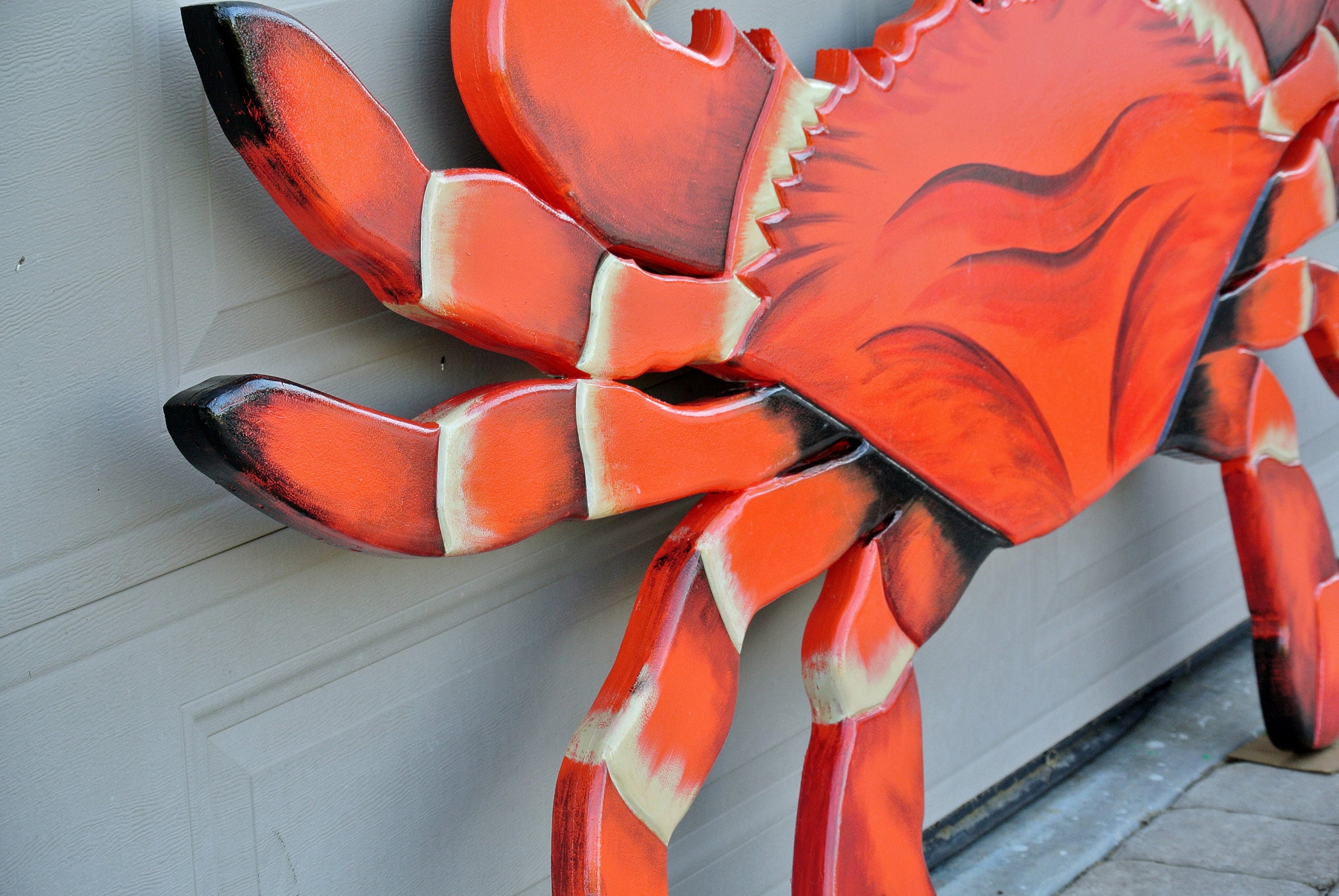 Red wooden crab Seafood Restaurant outdoor decor. Entryway large