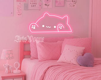 May include: A pink bedroom scene with a neon cat light above a bed. The bed is covered in pink bedding and pillows. A nightstand with a lamp and decor is on the left. The wall has art prints. The text "Arts Vogue" is visible.