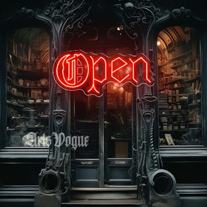 Puede incluir: Una fachada de tienda con un letrero de neón rojo "Open". La entrada está enmarcada por detalles arquitectónicos grises oscuros y ornamentados. El interior de la tienda es visible a través de las puertas de vidrio, lleno de estantes y objetos. El nombre de la tienda, "Arts Vogue", está escrito en blanco.