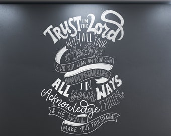 May include: A dark gray wall with white lettering that reads "Trust in the Lord with all your heart & do not lean on your own understanding, in all your ways acknowledge Him & He will make your path straight."