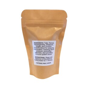 May include: Brown paper pouch with white text listing the ingredients and instructions for a caffeine-free, vegan herbal tea blend. The ingredients include Tulsi, Fennel, Ashwagandha, Shatavari, Ginger, and Licorice.