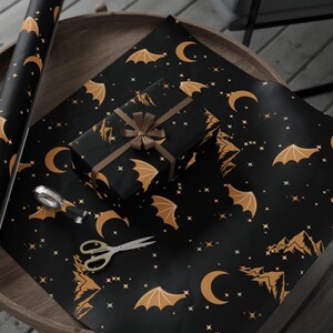 ACOTAR Themed Night Court Wrapping Paper Black Gold Design Wing Pattern Collection Star Mountain Motif Rhysand Inspired Gift Wrap Special Occasion Paper Quality Construction Large Format Sheet Multiple Size Options Fantasy Present Packaging