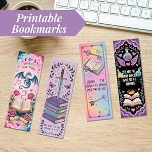 May include: Four colorful printable bookmarks with fantasy themes. One features a dragon, another a sword, a third a key and open book, and the last a potion bottle. Each bookmark has unique text and illustrations, set against a light wood background.