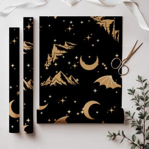 ACOTAR Themed Gift Wrap Collection Rhysand Night Court Design Black Gold Pattern Wing Motif Details Star Mountain Artwork Elegant Present Packaging Special Occasion Paper Beautiful Artistic Creation Multiple Size Options Fantasy Wrapping