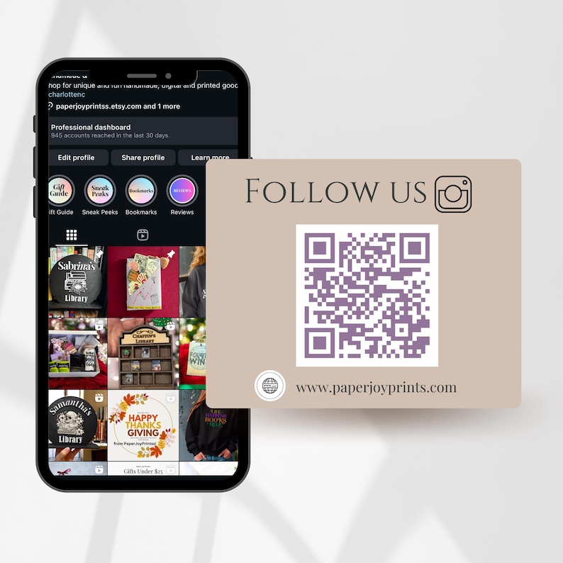 May include: A smartphone displaying an Etsy shop profile with various product images. A tan card with the text "FOLLOW US" and a QR code is in the foreground. The website address www.paperjoyprints.com is also visible.
