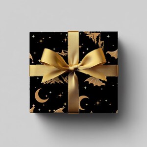ACOTAR Themed Wrapping Paper Night Court Rhysand Collection Black Gold Design Wing Pattern Details Star Mountain Artwork Elegant Gift Wrap Beautiful Present Packaging Multiple Size Options Quality Construction Special Occasion Paper