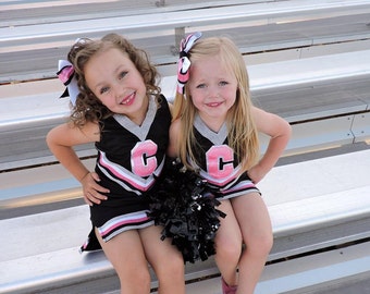 Customizable Girls Cheer uniform! Fun for dress up, halloween or to show team spirit! Built in shorts and bow included!