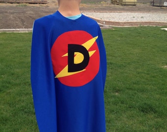 Super hero cape w/custom letter of your choice!  Every child needs to express the super hero inside themselves:) machine washable