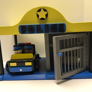 Wooden Toy Toddler Police Station Set with Police Car, 2 Policemen, 2 "Bad Guys", Jail and Bed.