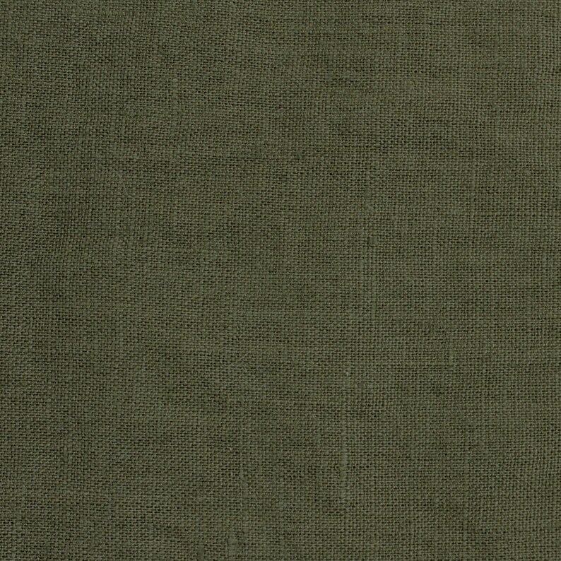 May include: A close-up of a dark green fabric with a woven texture.