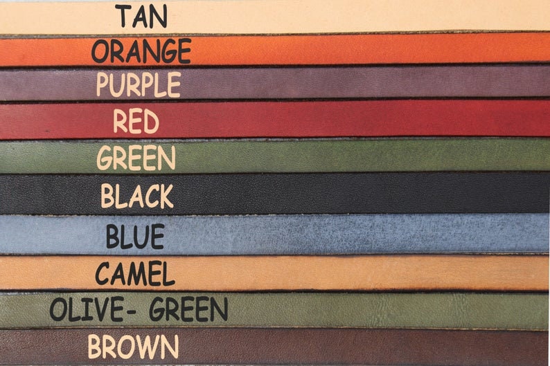 Pu&ograve; includere: Una selezione di cinturini in pelle in vari colori, tra cui beige, arancione, viola, rosso, verde, nero, blu, cammello, verde oliva e marrone.