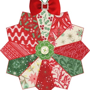 May include: A red and green Christmas ornament with a bow and a button in the center. The ornament is made of fabric scraps and has a starburst shape.