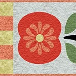 May include: A repeating pattern of red stylized apples with green leaves and black stems on a white background. The apples have a floral design inside. The background has a repeating pattern of orange and yellow squares.