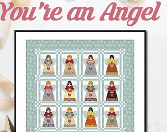 May include: A quilt pattern featuring 16 angels with red hearts and wings, surrounded by a blue and white snowflake pattern. The quilt is framed in black and has the text "You're an Angel" at the top and "Angie Padilla" at the bottom.