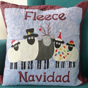 Get festive with the Fleece Navidad applique cushion cover pattern. Create a whimsical holiday decor featuring five sheep in Christmas hats. Perfect for cozy and joyful Christmas vibes.