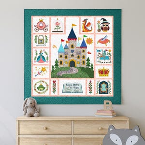 May include: A colorful quilt featuring a fairytale theme with a central castle design. The quilt includes various square panels with images of a princess, dragon, crown, frog, and the text "Once Upon A Time". The quilt is framed with a teal border.