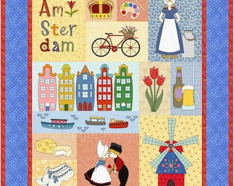 Könnte beinhalten: Ein farbenfroher Quiltblock mit den Worten "Amster dam" und Bildern der niederländischen Kultur, darunter eine Windmühle, Tulpen, ein Fahrrad und traditionelle Häuser.