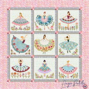 May include: A quilt with a pink background and nine squares. Each square features a ballerina with a colourful skirt made of flowers. The ballerina's skirts are different colours and patterns. The quilt is signed "Angie Padilla".