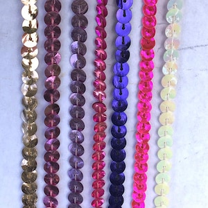 1 yard of single strand Metallic Sequin Trim 1/4&quot; wide in many colors.